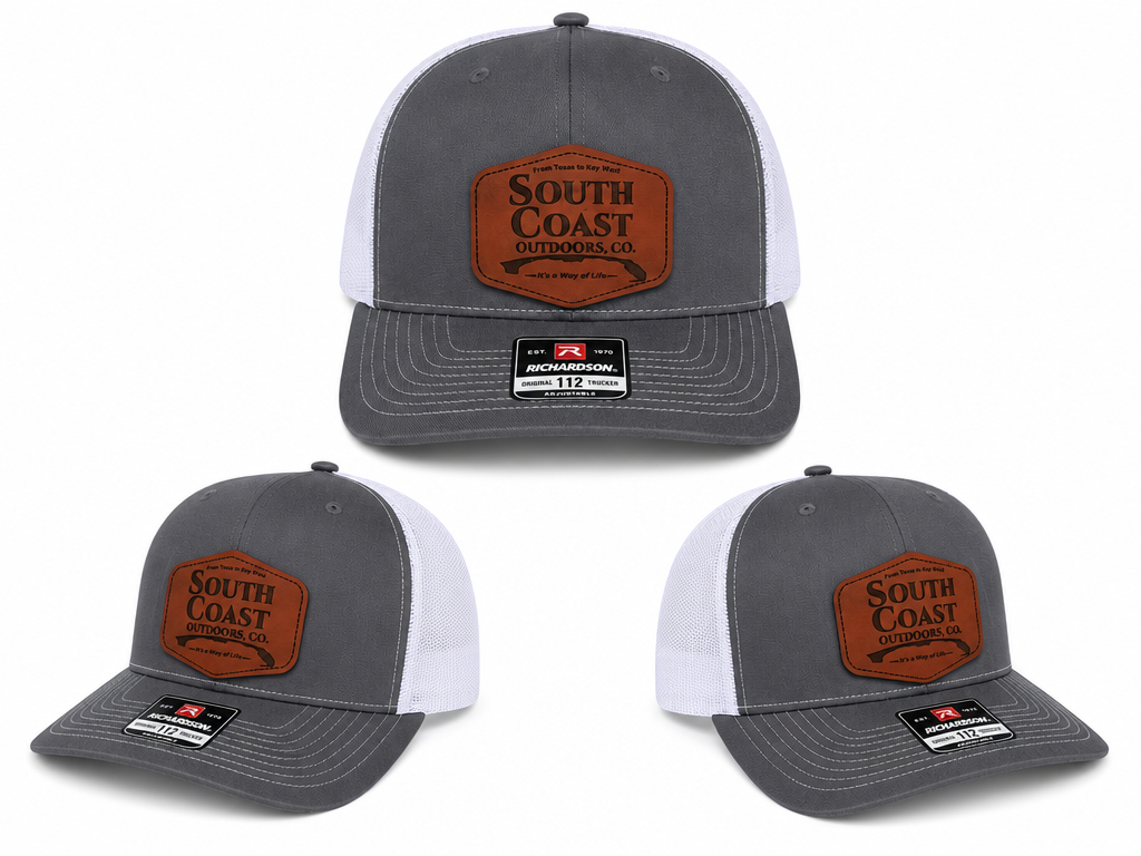 Gray/white trucker hat with orange front patch and Richardson 112 logo