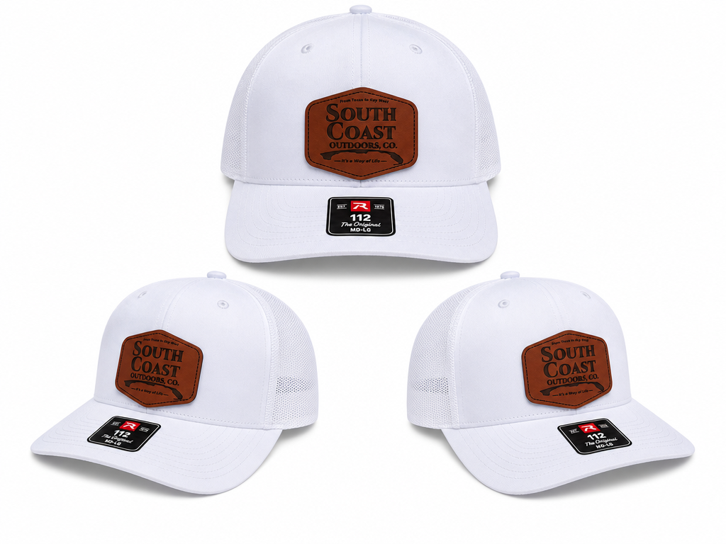 White trucker hat with brown front logo patch and black side label