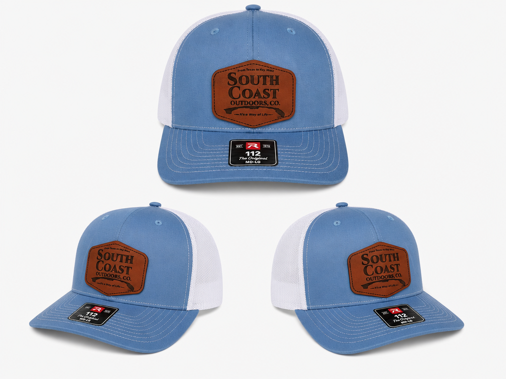 Blue and white trucker hat with South Coast Outdoors logo patch