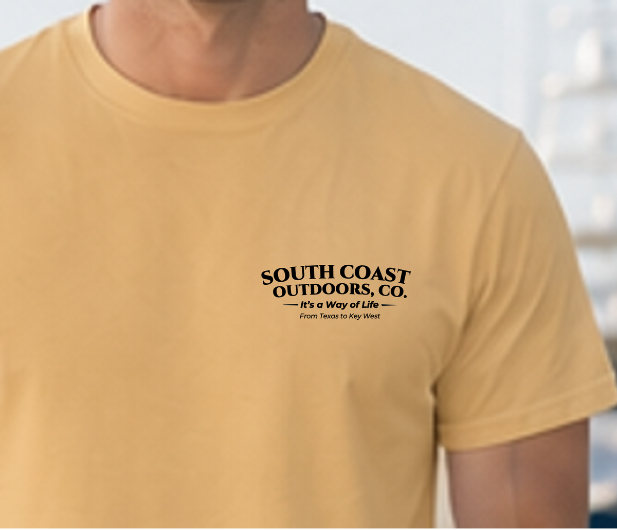 Light yellow short-sleeve T-shirt with small chest logo and boardwalk graphic