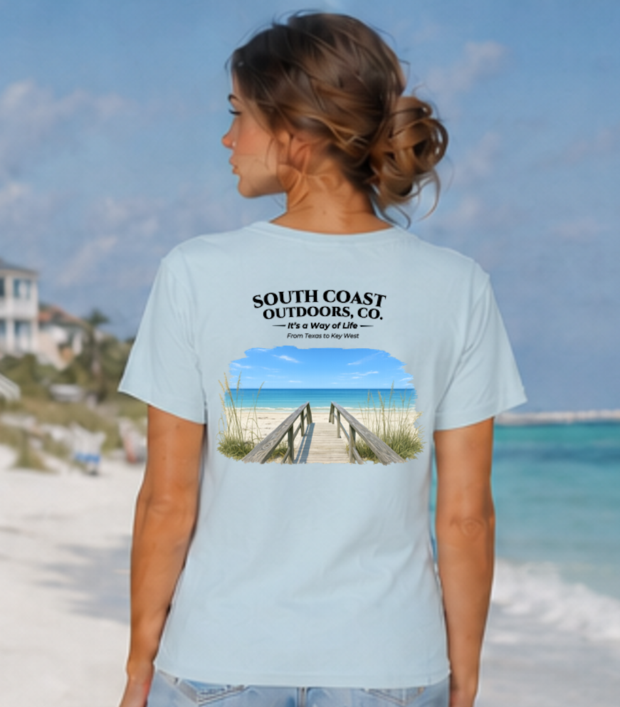 Women’s light blue graphic t-shirt with back logo text and beach pier graphic