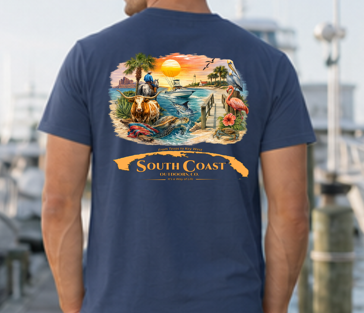 Navy short-sleeve T-shirt with South Coast graphic on back, flaming sunset and animals