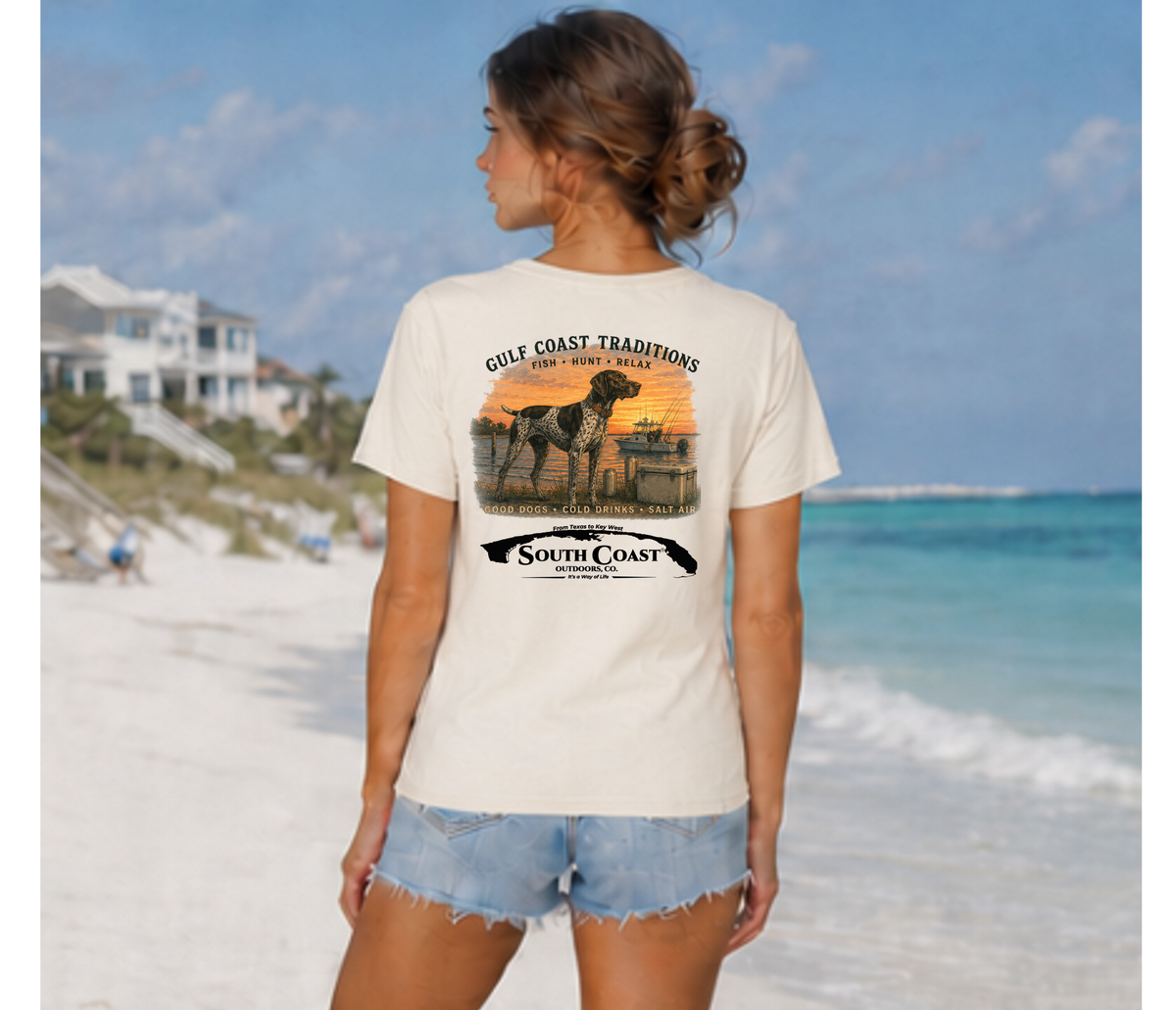 Back view of white graphic T-shirt with Gulf Coast Traditions dog and sunset print