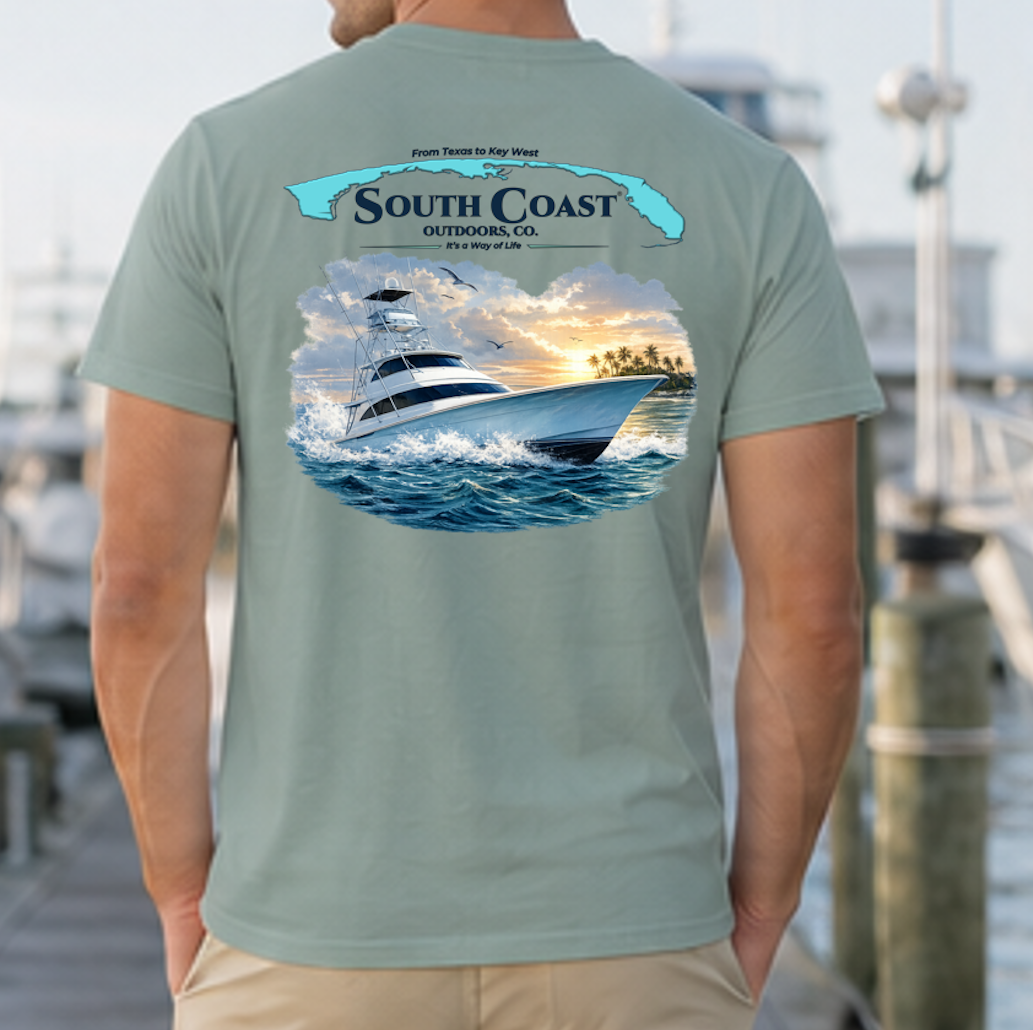 Seafoam green sport fishing T-shirt with back graphic of boat on waves