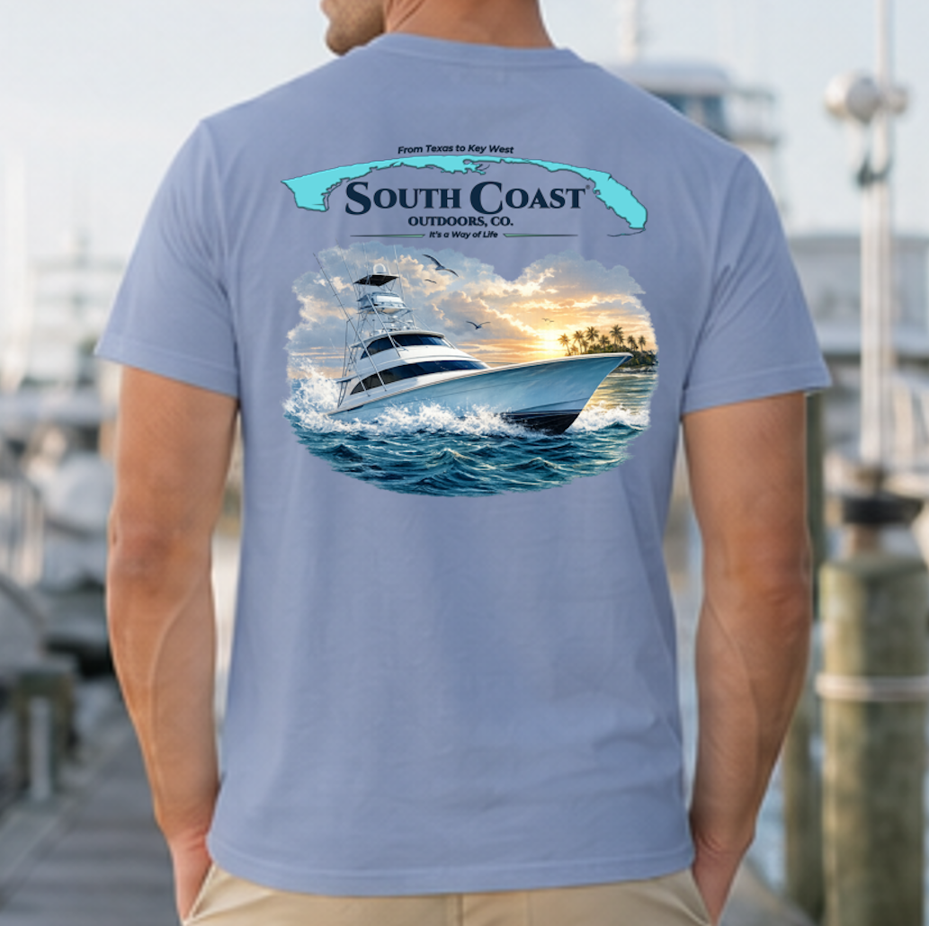 Blue sport fishing T-shirt with back graphic of boat at sea