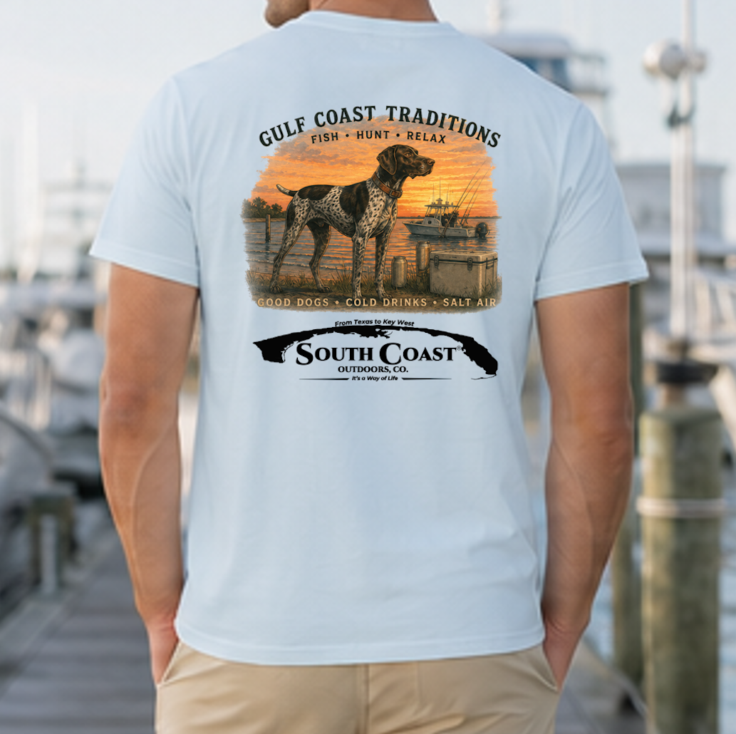 Light sky blue crewneck T-shirt with back graphic of dog, gulf coast scene, and South Coast logo