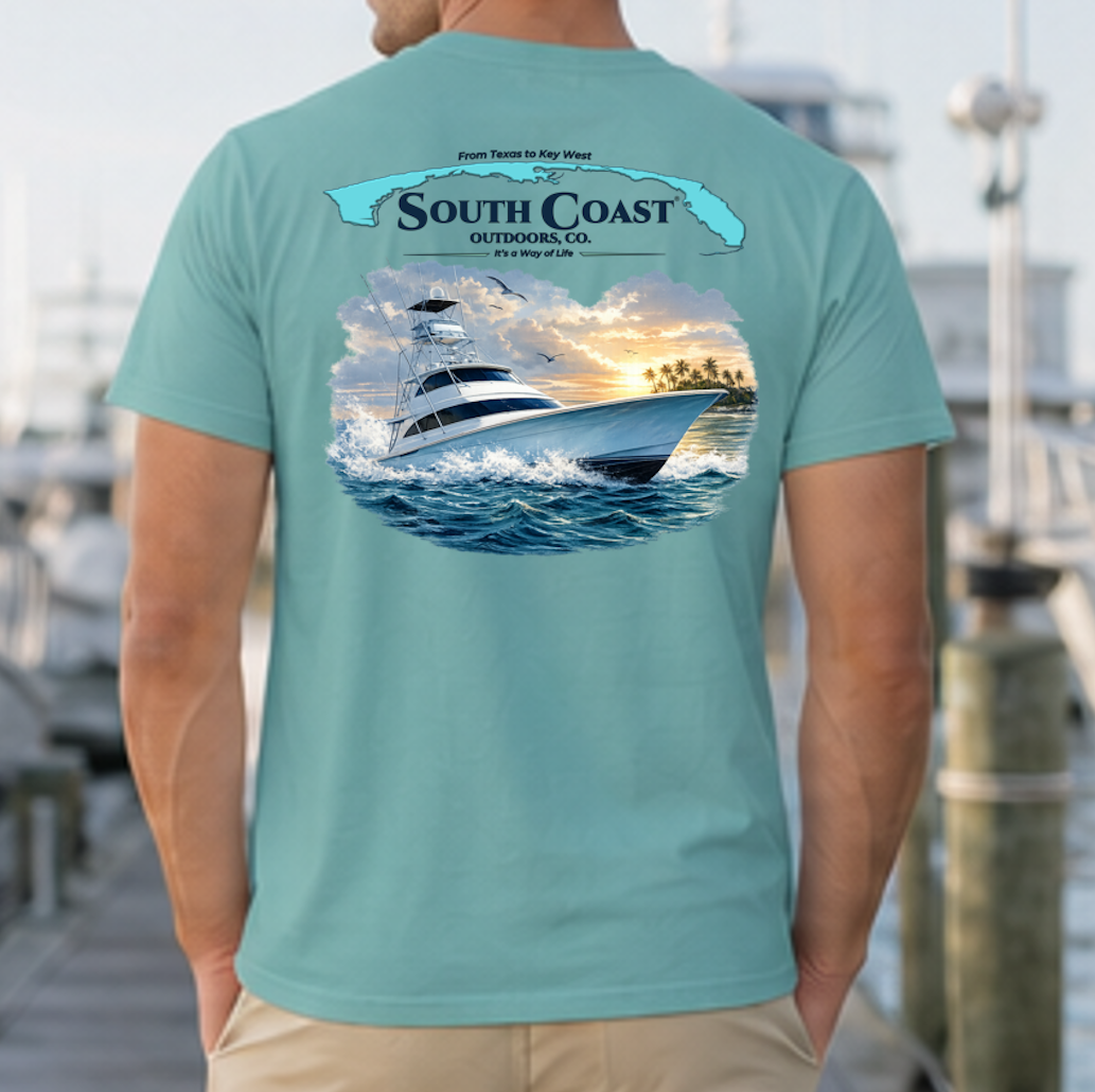 Teal sport fishing T-shirt with back graphic of fishing boat in ocean