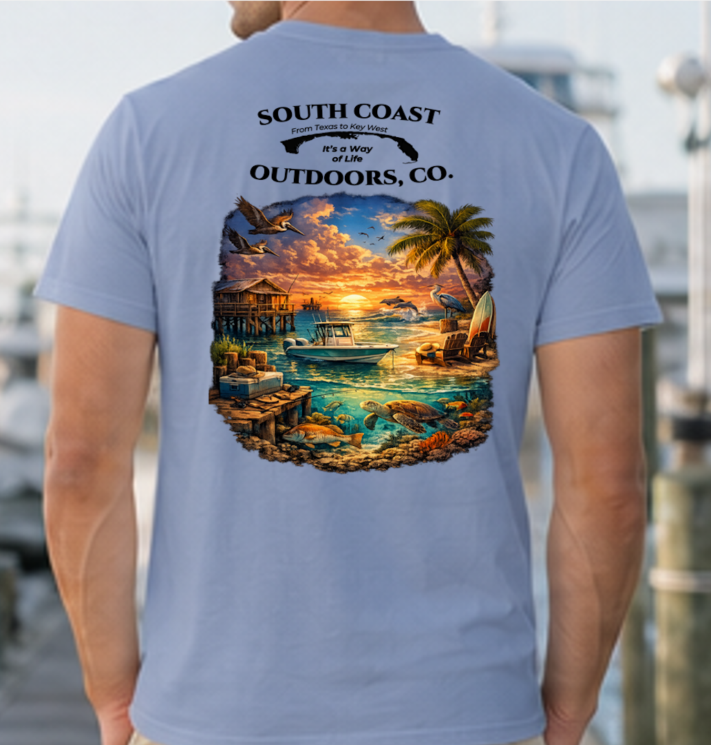 Light blue graphic T-shirt with round sunset beach wildlife print on back