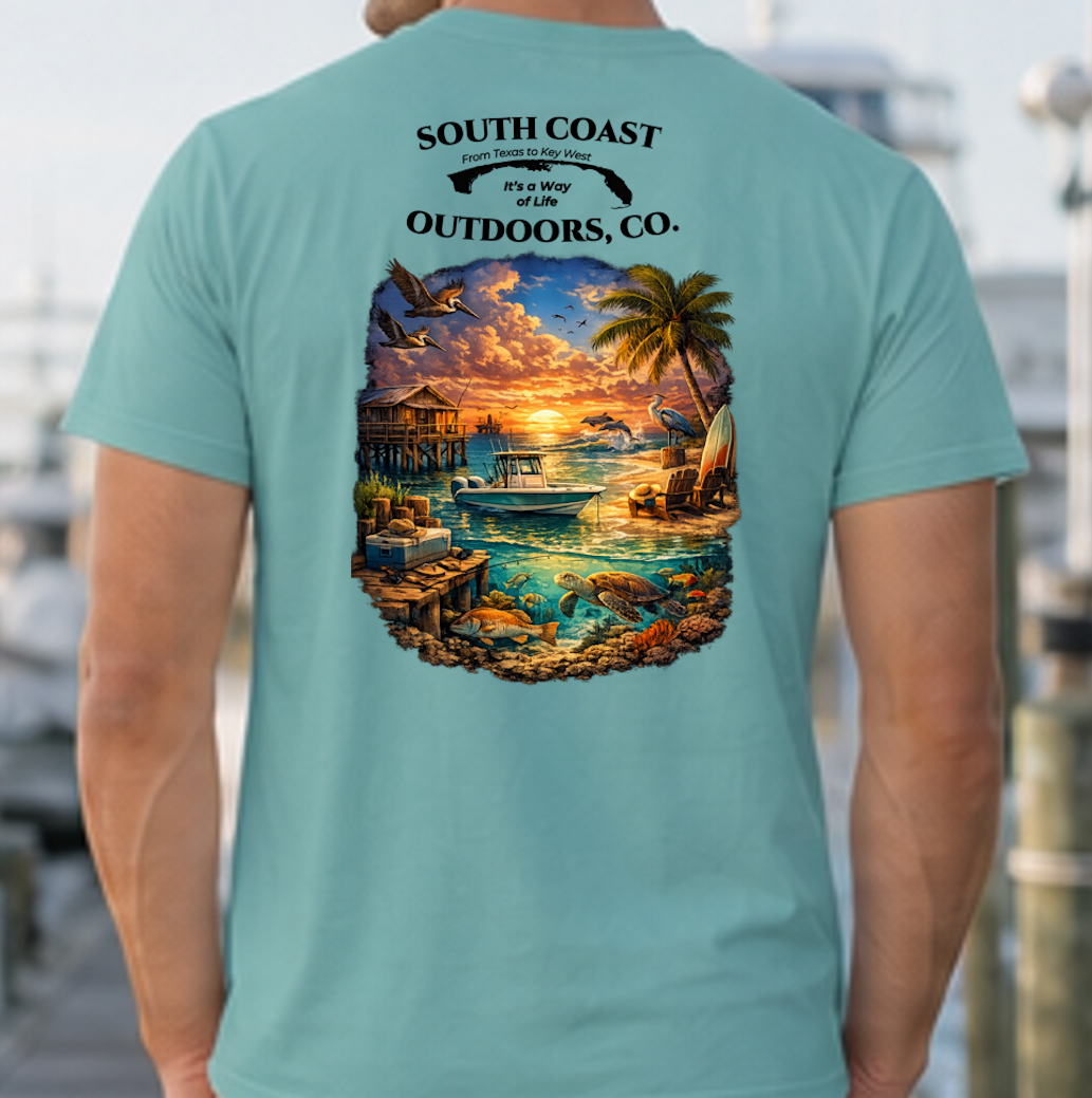 Teal graphic T-shirt with round sunset beach wildlife print on back