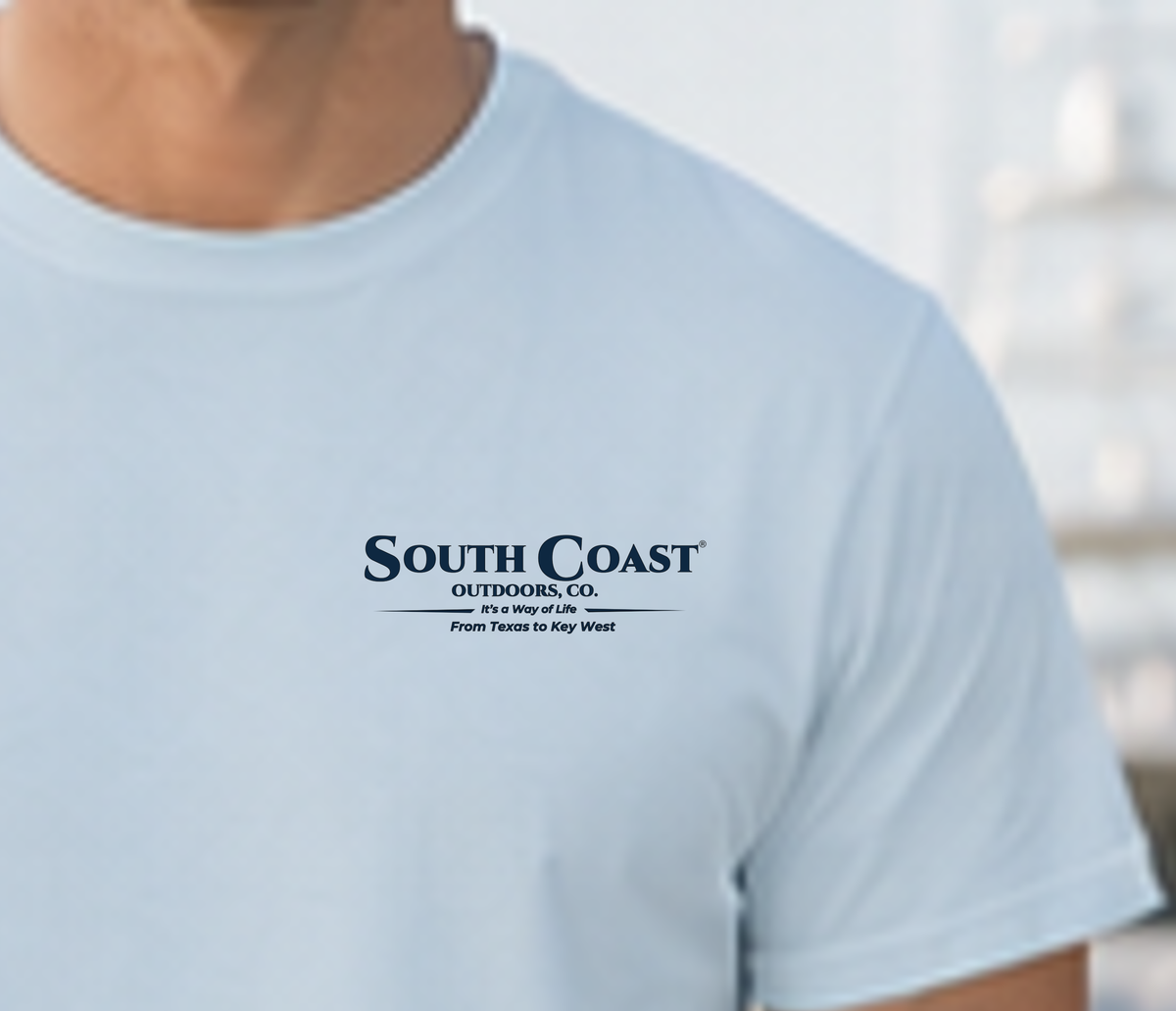 Light blue T-shirt front with South Coast Outdoor Co logo print