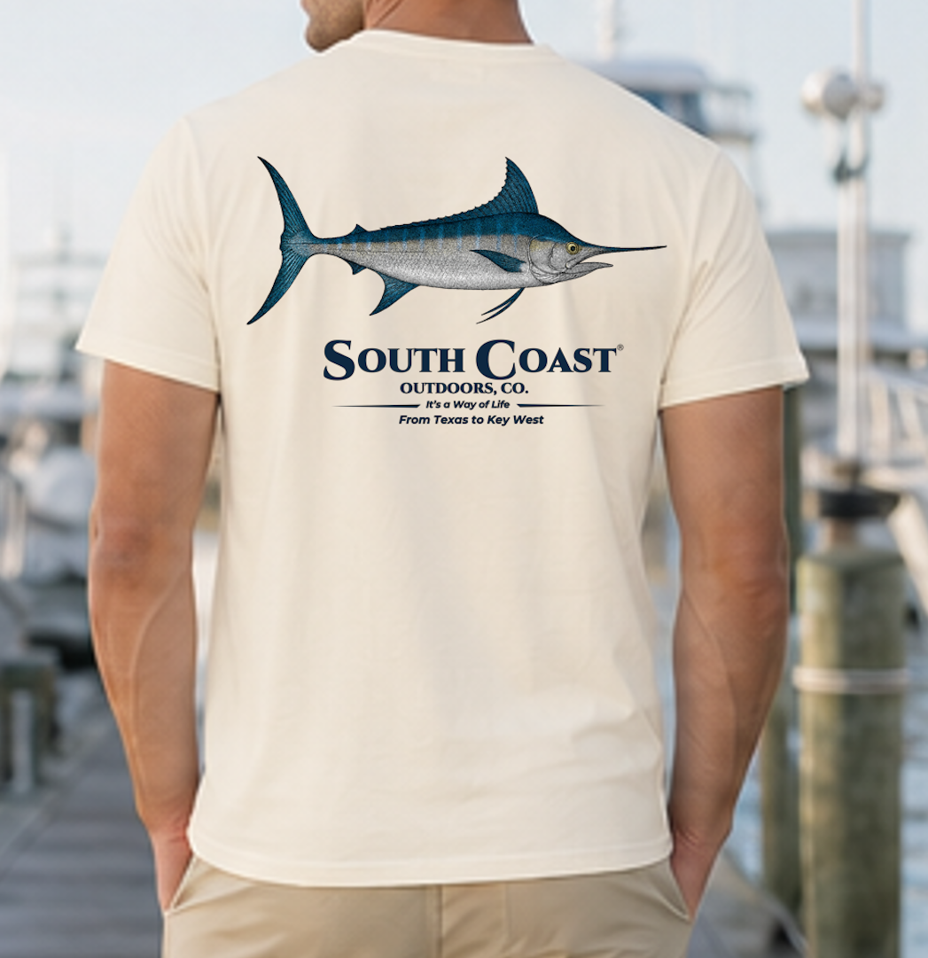 Ivory t-shirt with blue marlin fish graphic and South Coast logo on the back