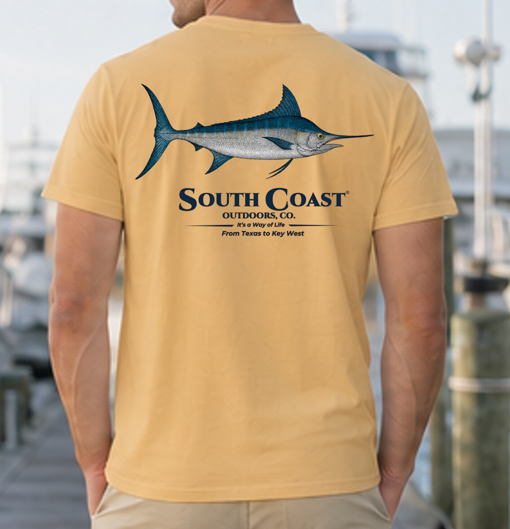 Light tan t-shirt with blue marlin fish graphic on the back