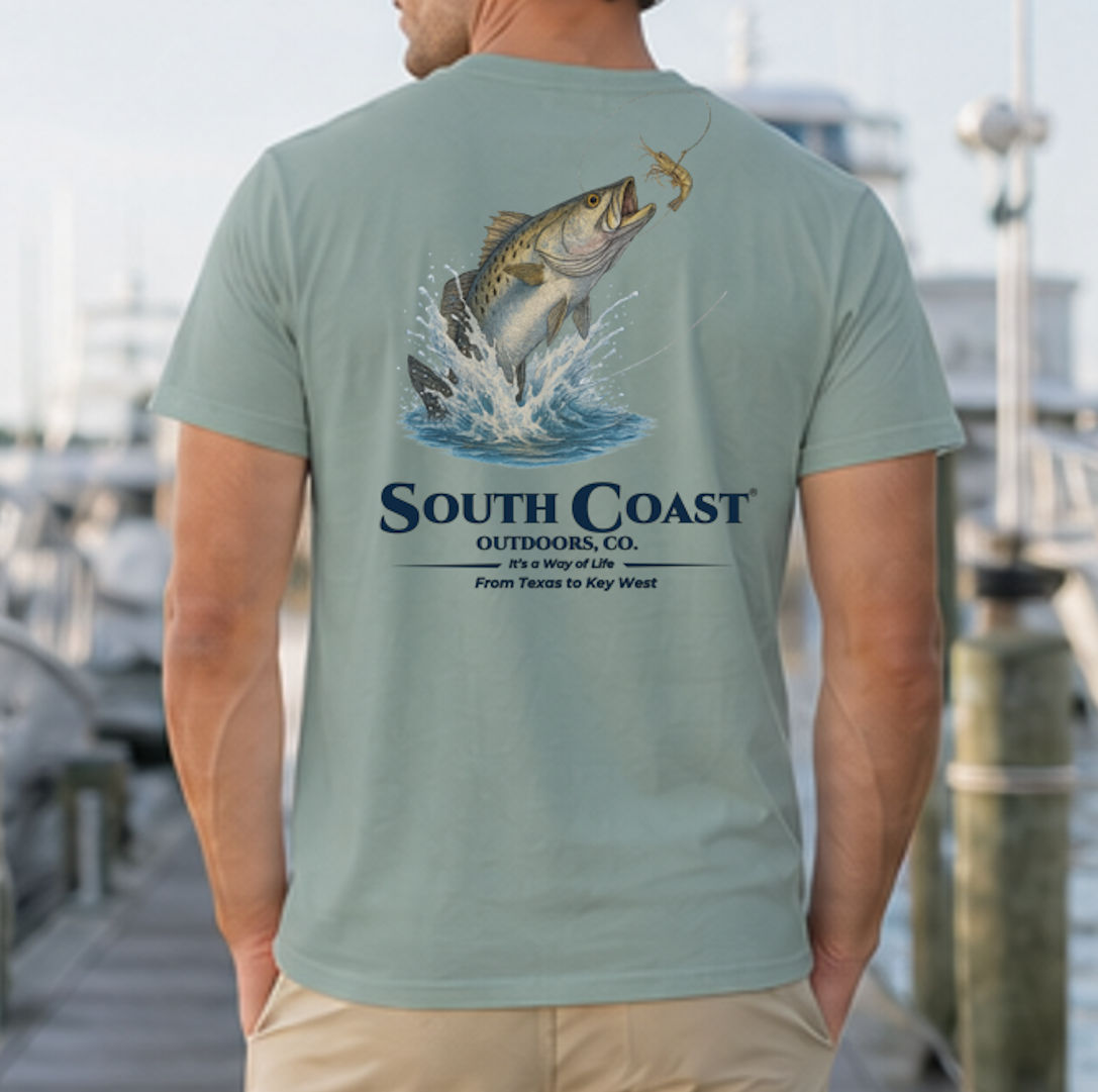 Sage green back graphic fishing t-shirt with sea trout jumping and “South Coast” logo