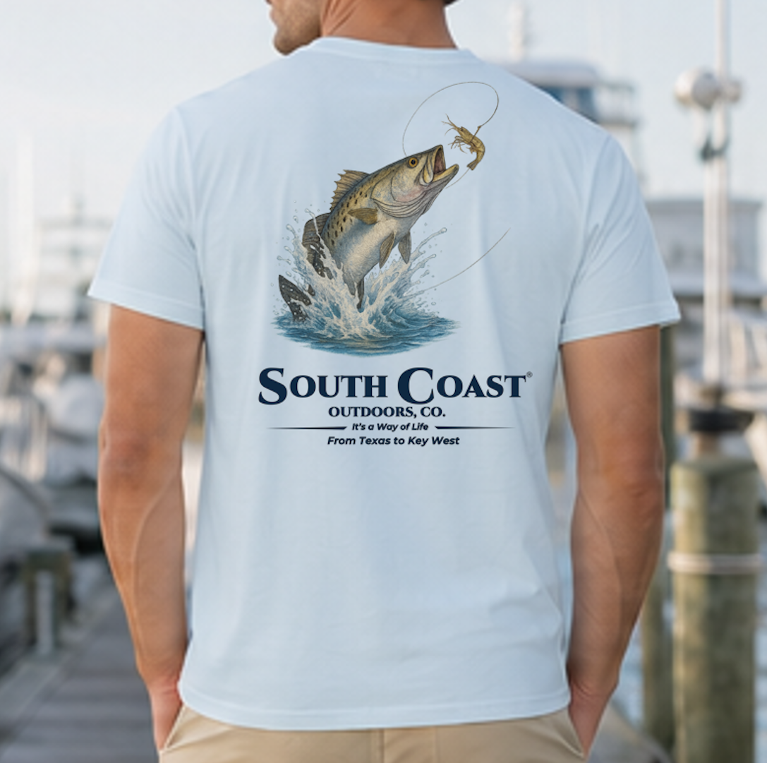 Light blue back graphic fishing t-shirt with sea trout jumping and “South Coast” logo