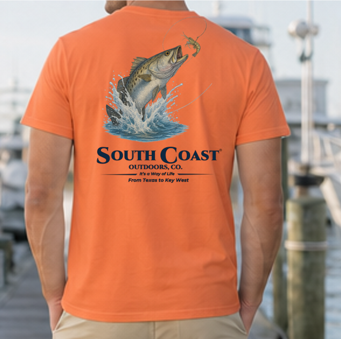 Burnt orange back graphic fishing t-shirt with sea trout jumping and “South Coast” logo