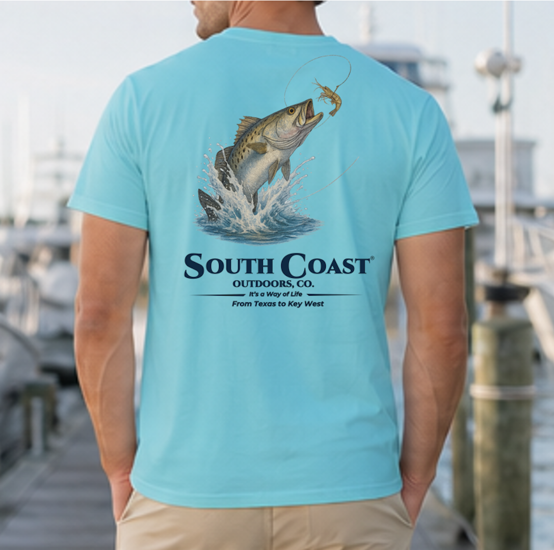 Turquoise back graphic fishing t-shirt with sea trout jumping and “South Coast” logo