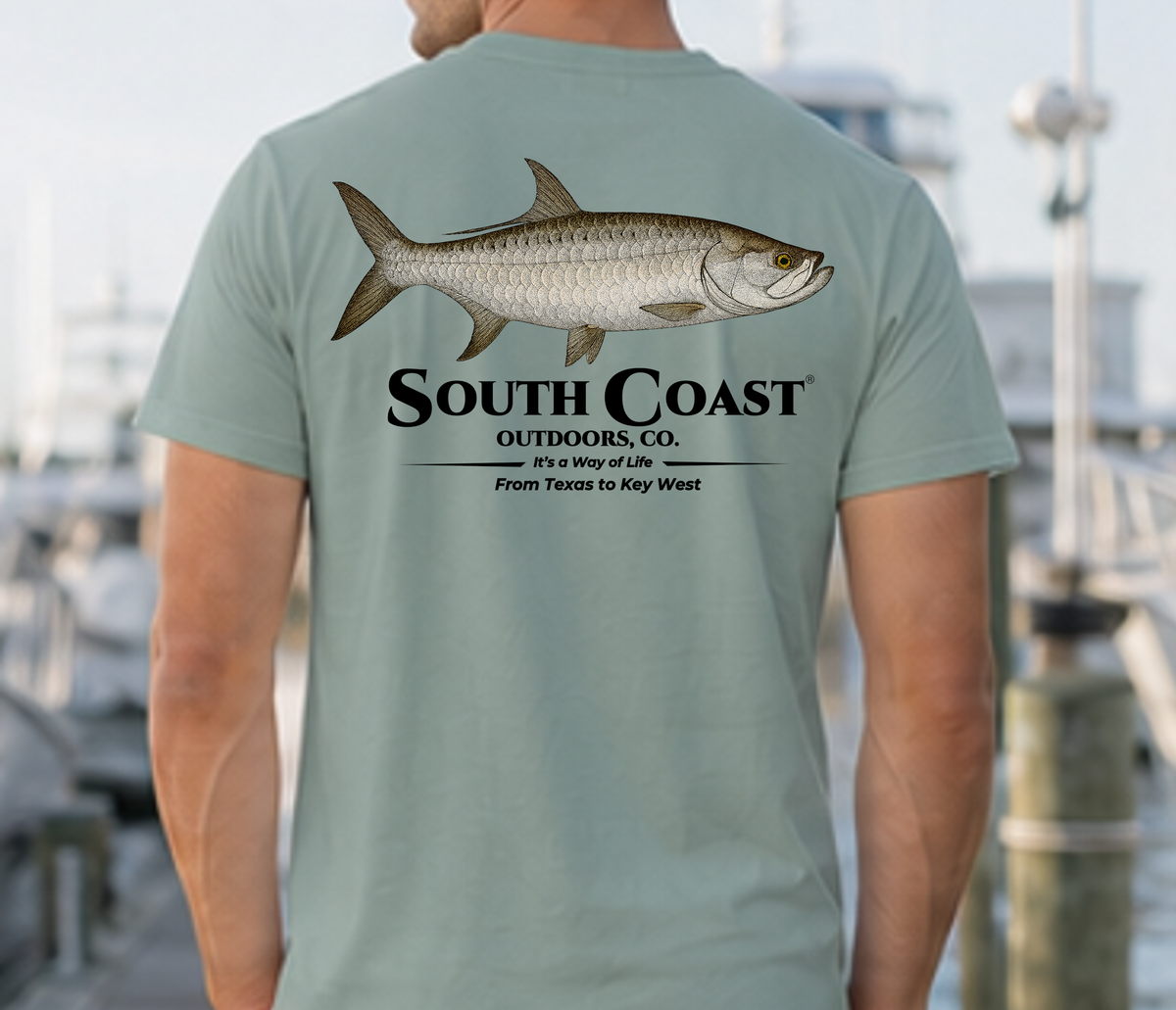 Mint green T-shirt with large back tarpon fish graphic and stacked black text