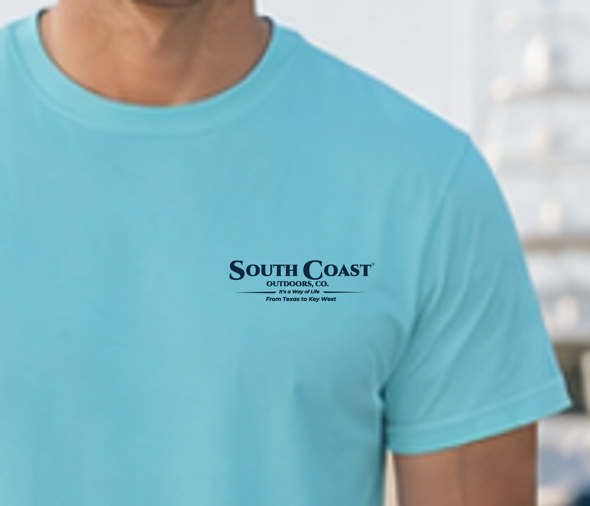 Light teal T-shirt with small South Coast Outdoor Co. logo on the chest