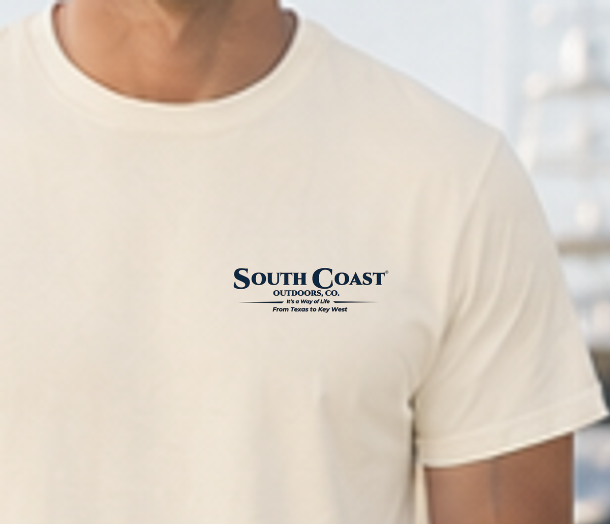 Ivory T-shirt with small mallard-themed logo patch on left chest