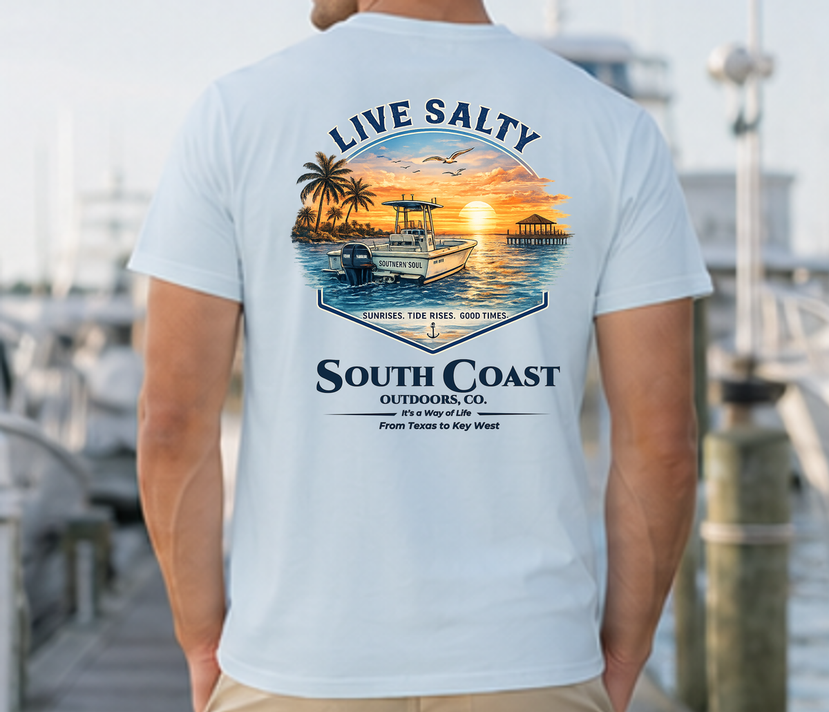 Light blue graphic T-shirt back view, South Coast Outdoors logo with boat art