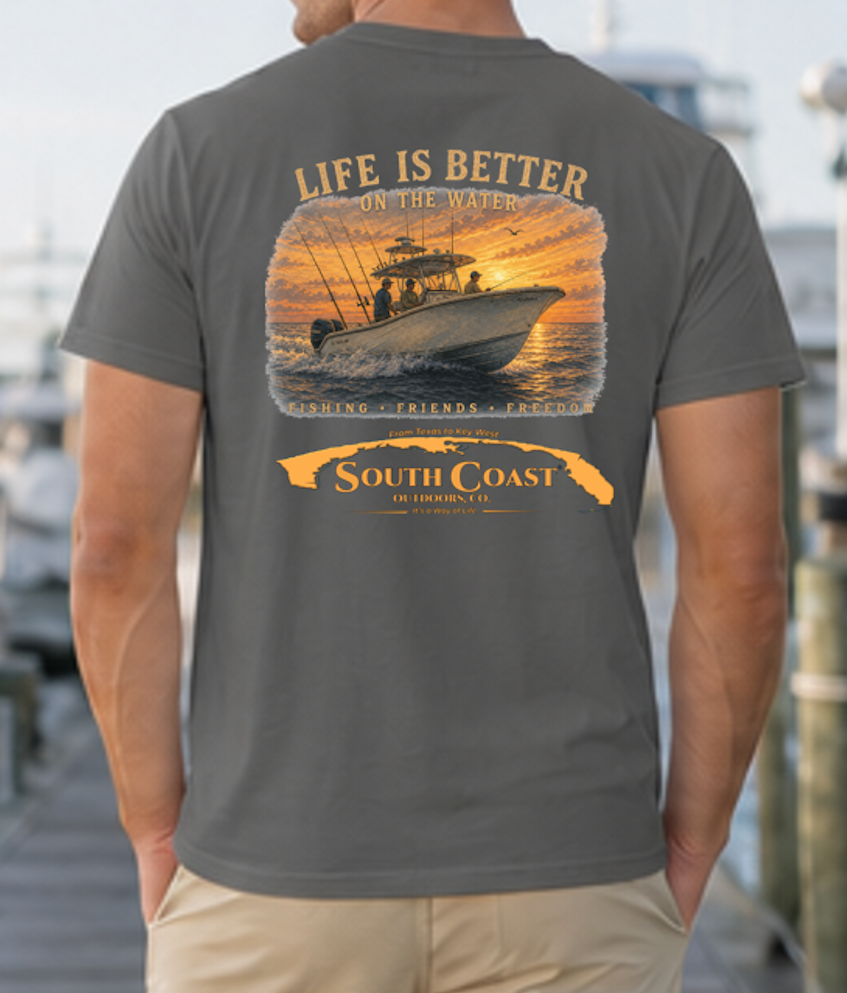 Dark gray t-shirt with back fishing boat sunset graphic and 'South Coast' banner