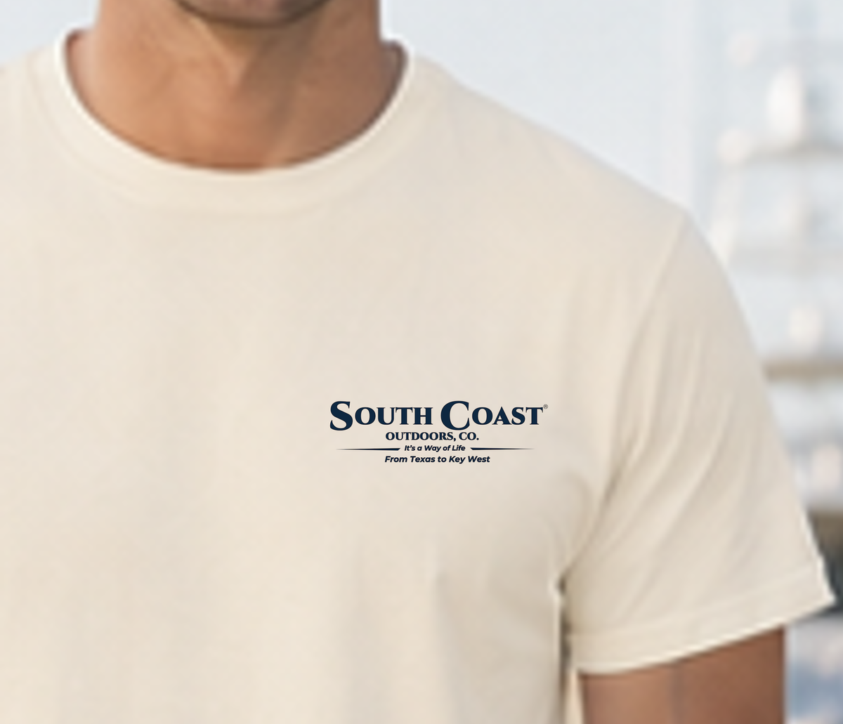 Ivory T-shirt with small South Coast Outdoors logo on chest