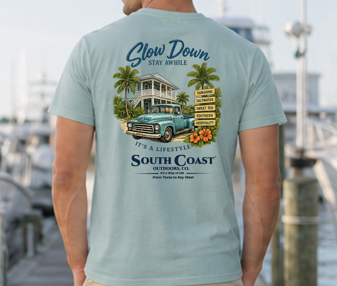Teal-green graphic T-shirt with 'Slow Down' beach house and truck back print