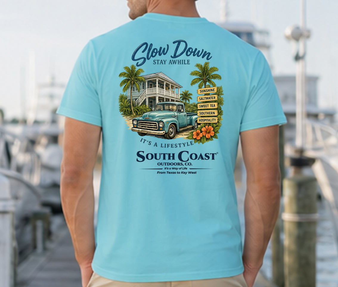 Turquoise graphic T-shirt with 'Slow Down' beach house and truck back print