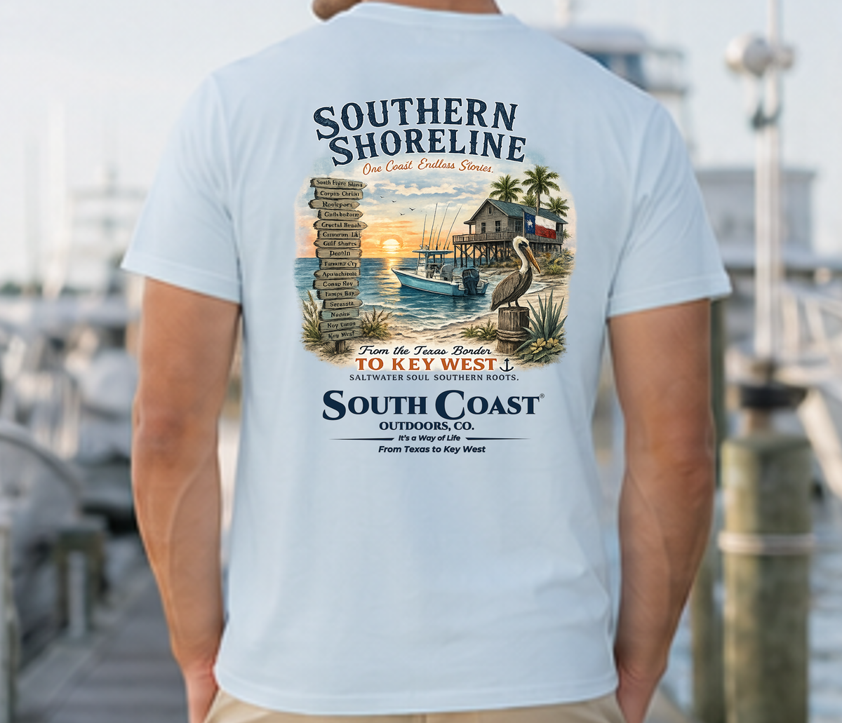 Light blue graphic T-shirt, back view with centered large coastal illustration