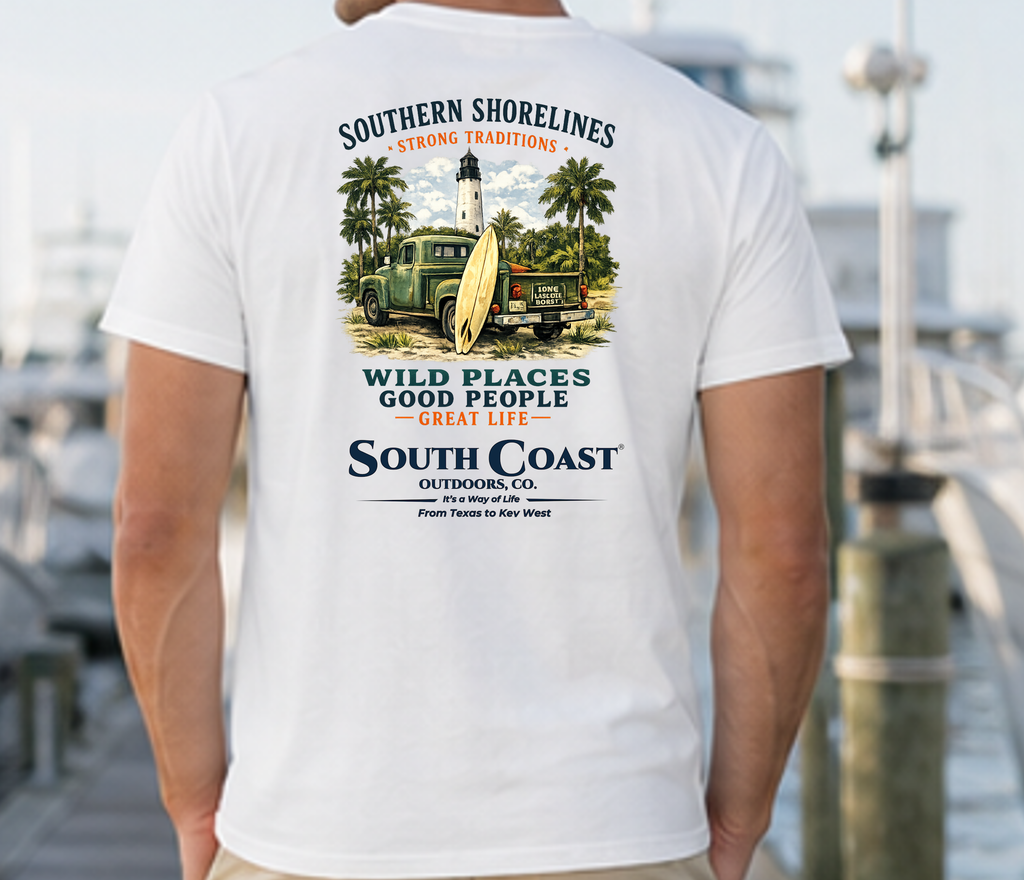 White graphic T-shirt back print featuring lighthouse, palms, and “Wild Places” wording