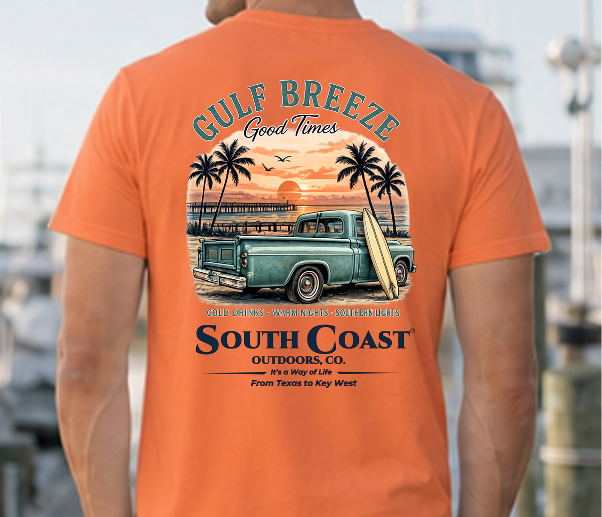 Orange Gulf Breeze T-shirt back view with truck, palm trees, “South Coast” print