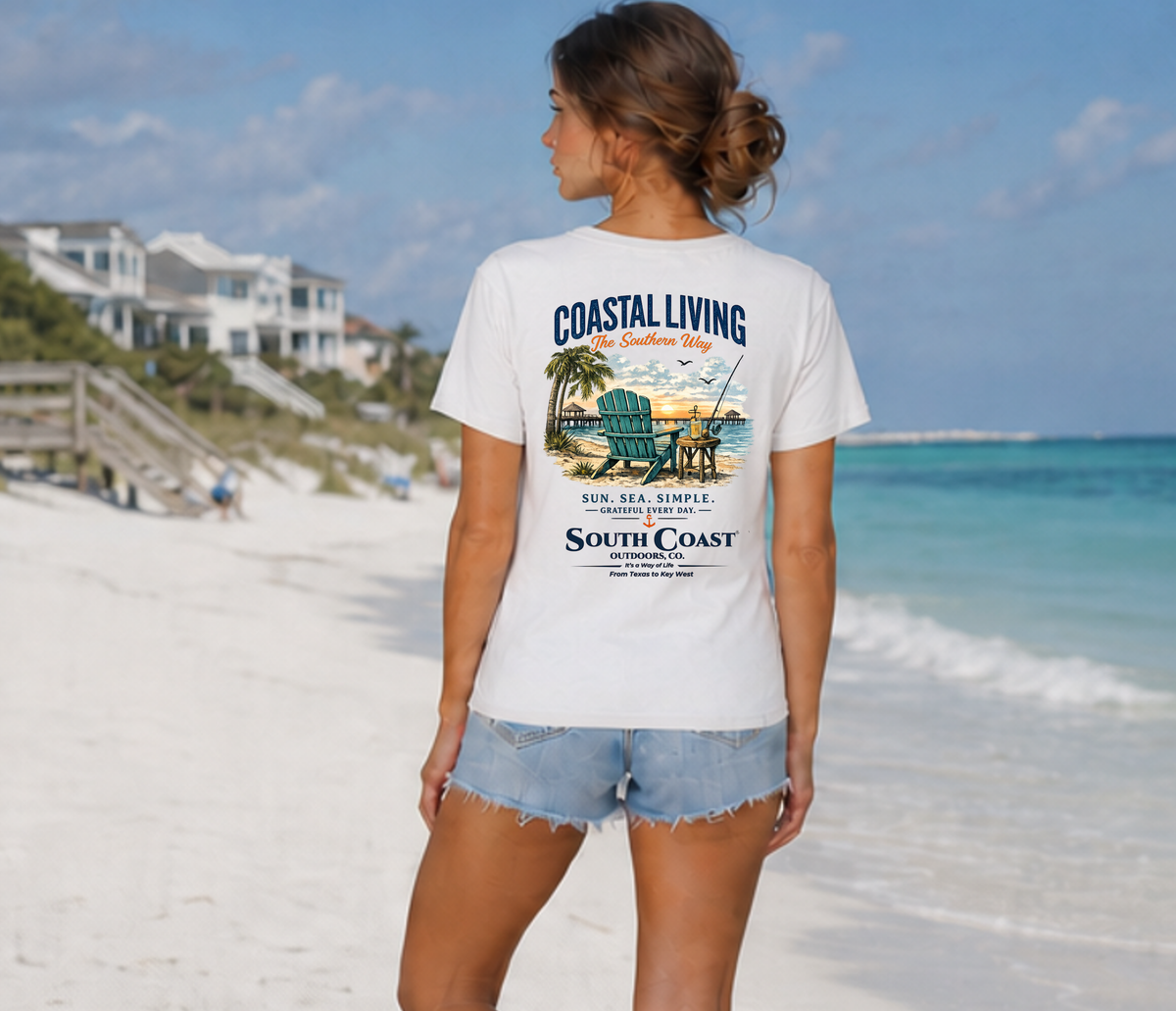 White graphic T-shirt on woman, beach chair artwork on the back