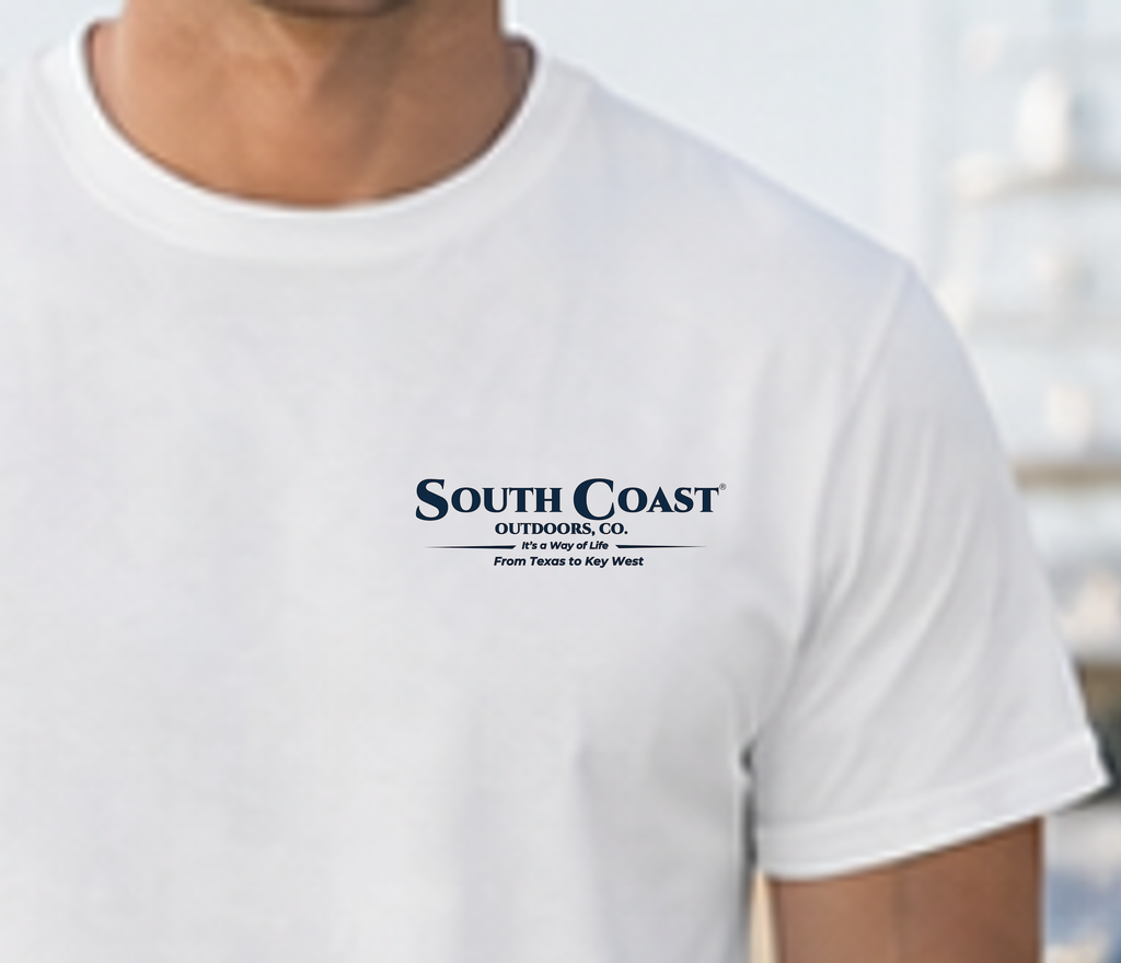 White graphic T-shirt with small chest logo text reading South Coast