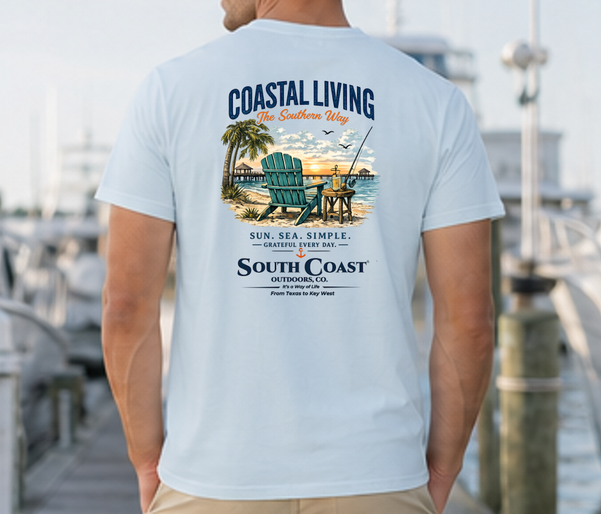 Light blue Coastal Living T-shirt with large back coastal scene graphic and text