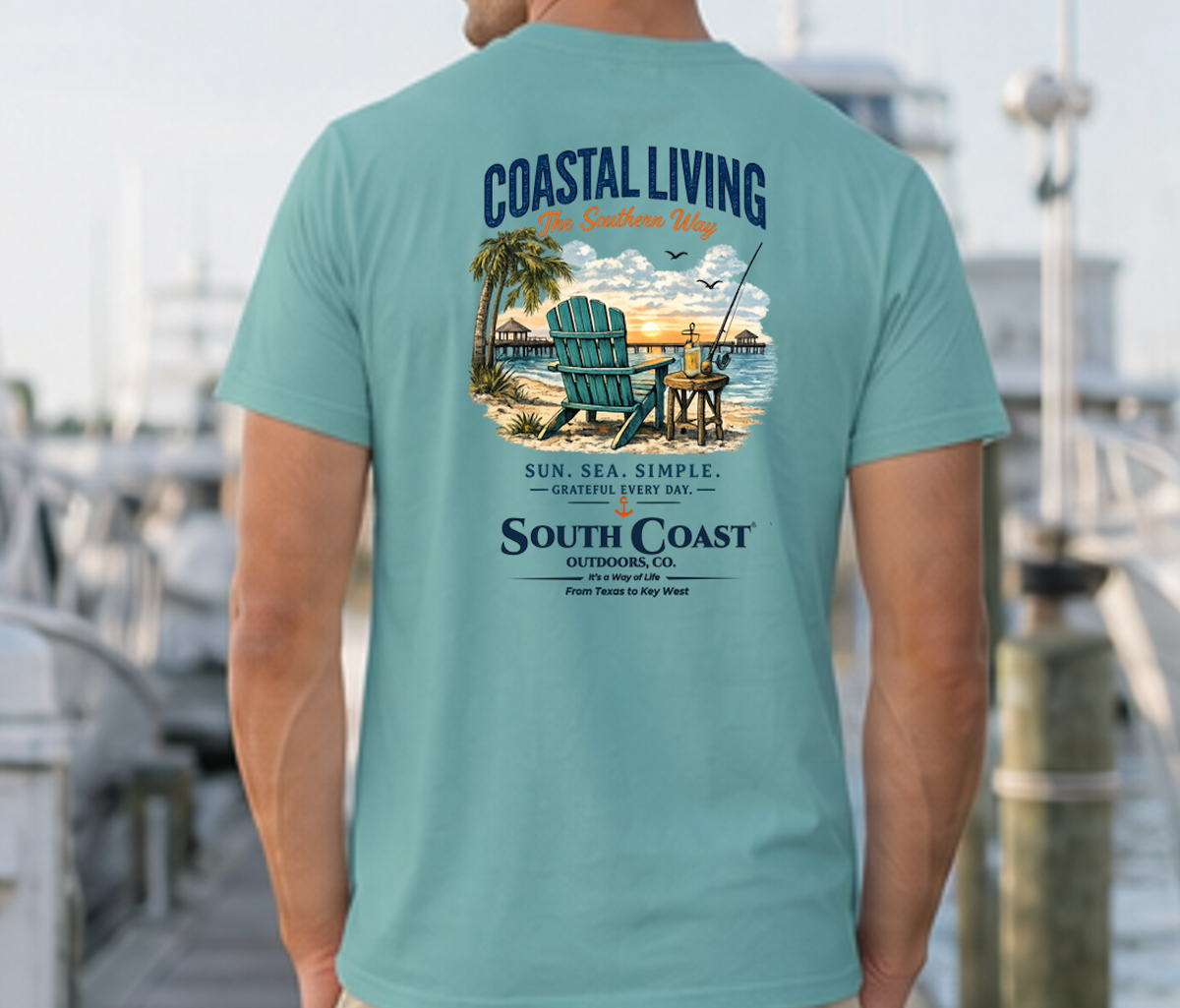 Teal Coastal Living T-shirt with large back coastal scene graphic and 'South Coast' text