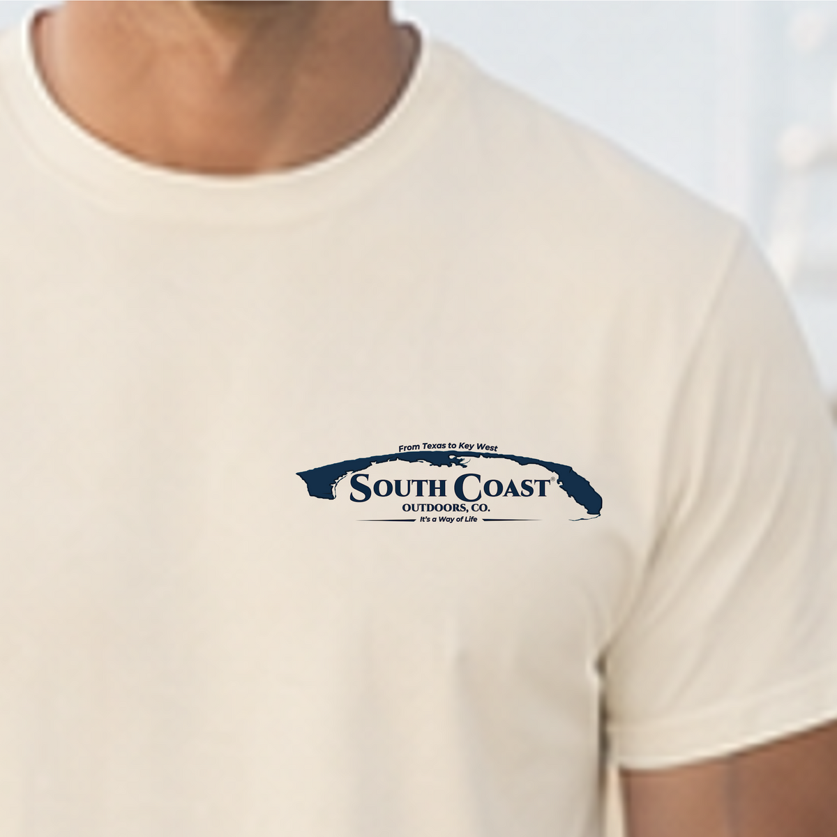 Cream T-shirt with small chest logo and South Coast map graphic