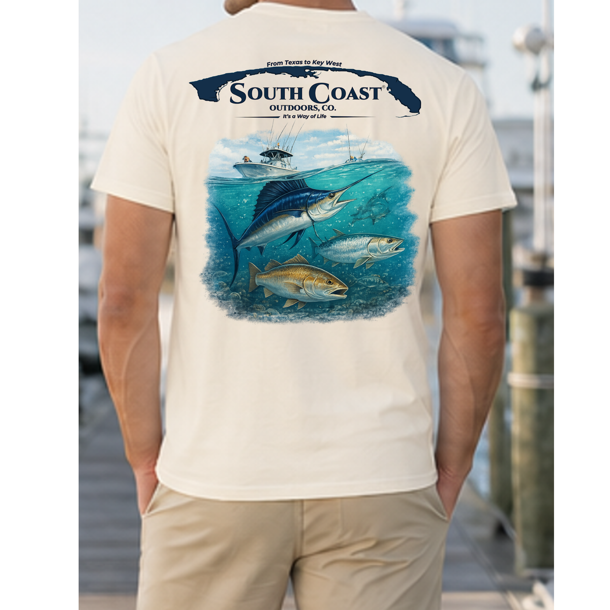 Cream T-shirt with large back fish-and-boat graphic and South Coast logo