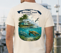 Ivory short-sleeve T-shirt with rear South Coast logo, island, and sea animals