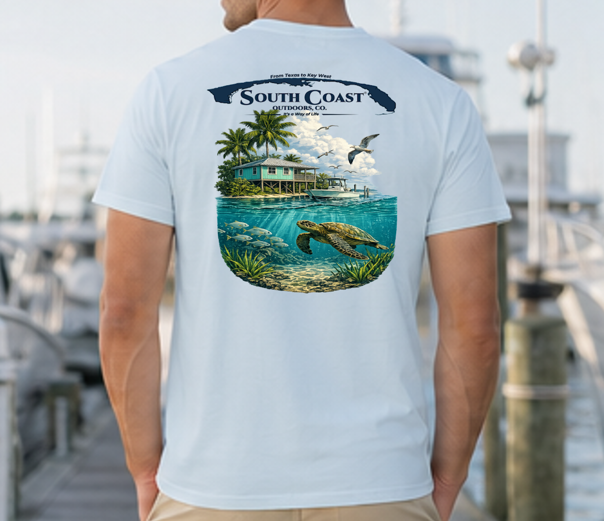 Men's light blue T-shirt with back tropical island graphic, sea turtle, palm trees and logo