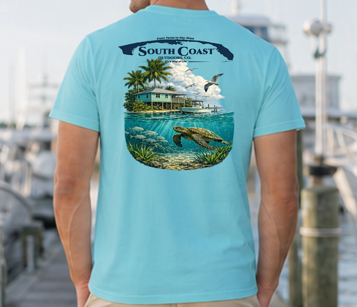Men's turquoise T-shirt with back tropical island scene graphic, sea turtle and logo