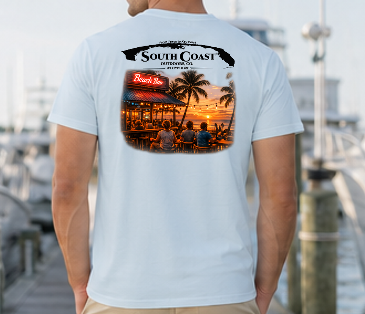 Men's light blue graphic T-shirt, back print with coastal bar logo and sunset photo