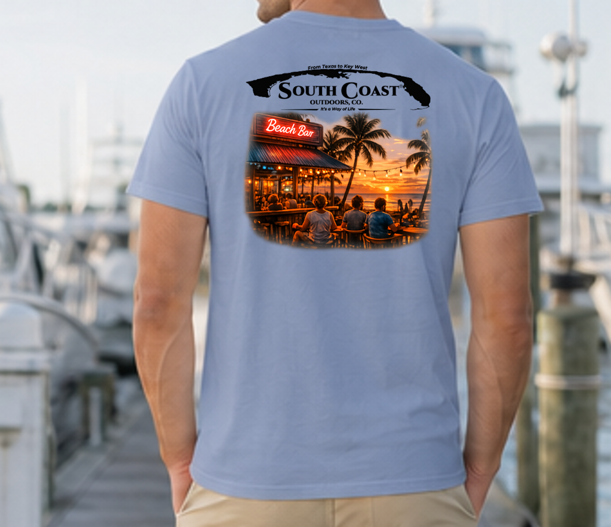 Men's blue graphic T-shirt, back print with coastal bar logo and sunset photo