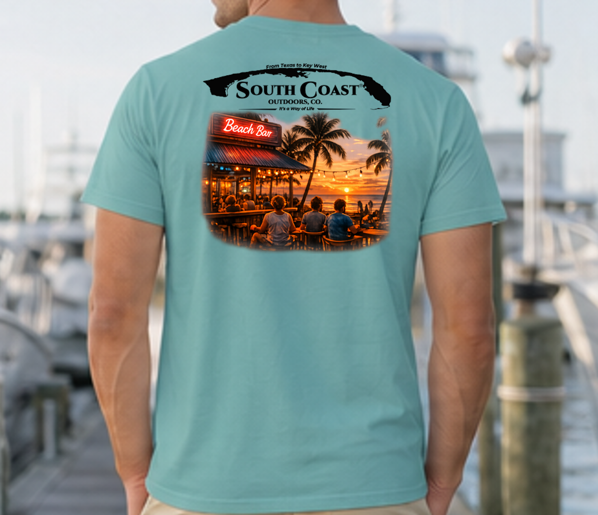 Men's teal graphic T-shirt, back print with coastal bar logo and sunset photo