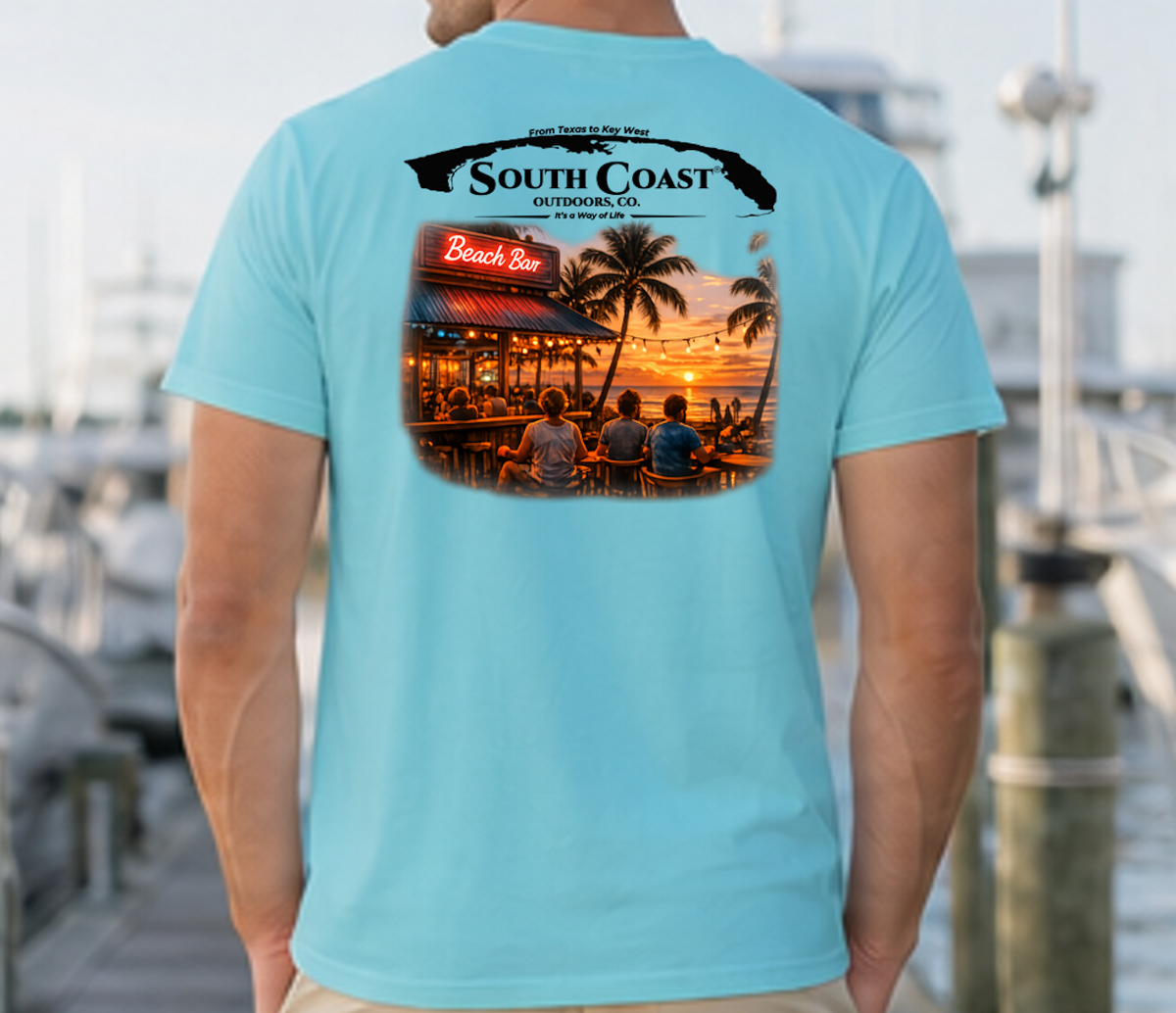Men's light blue graphic T-shirt, back print with coastal bar logo and sunset photo