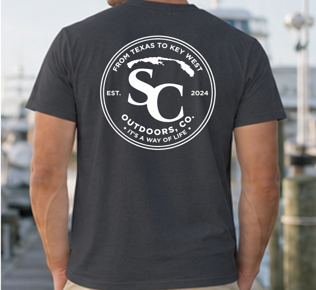 Black t-shirt with large circular back logo badge and text