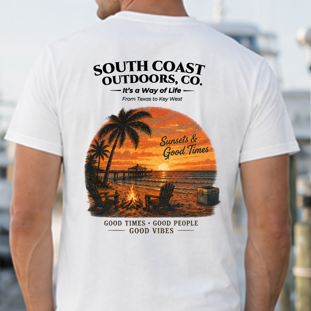 White T-shirt back close-up with South Coast Outdoors, Co. and sunset graphic