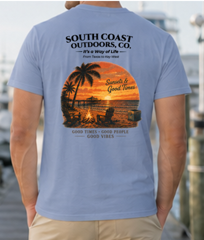 Chambray blue T-shirt with back print of palms, sunset, and campfire glow