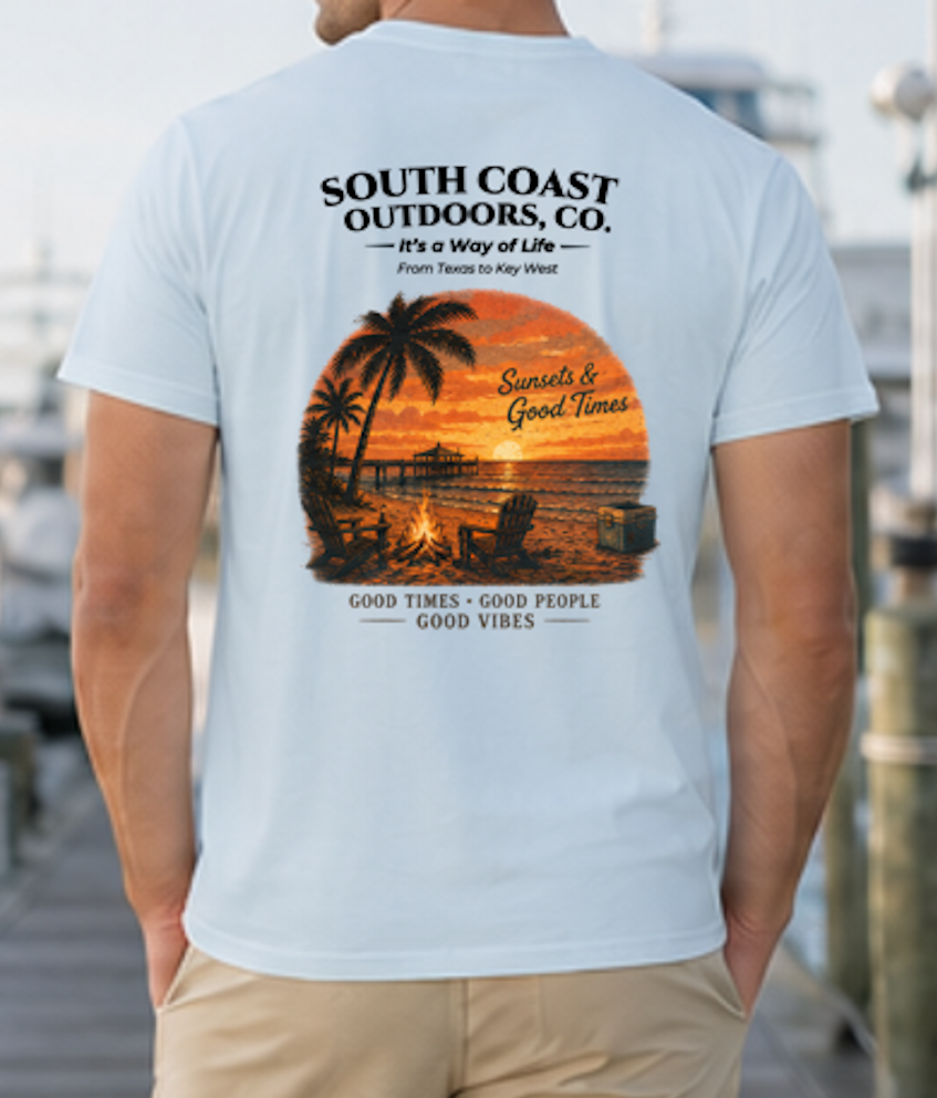 Light blue T-shirt with back graphic of palms, sunset, and campfire scene