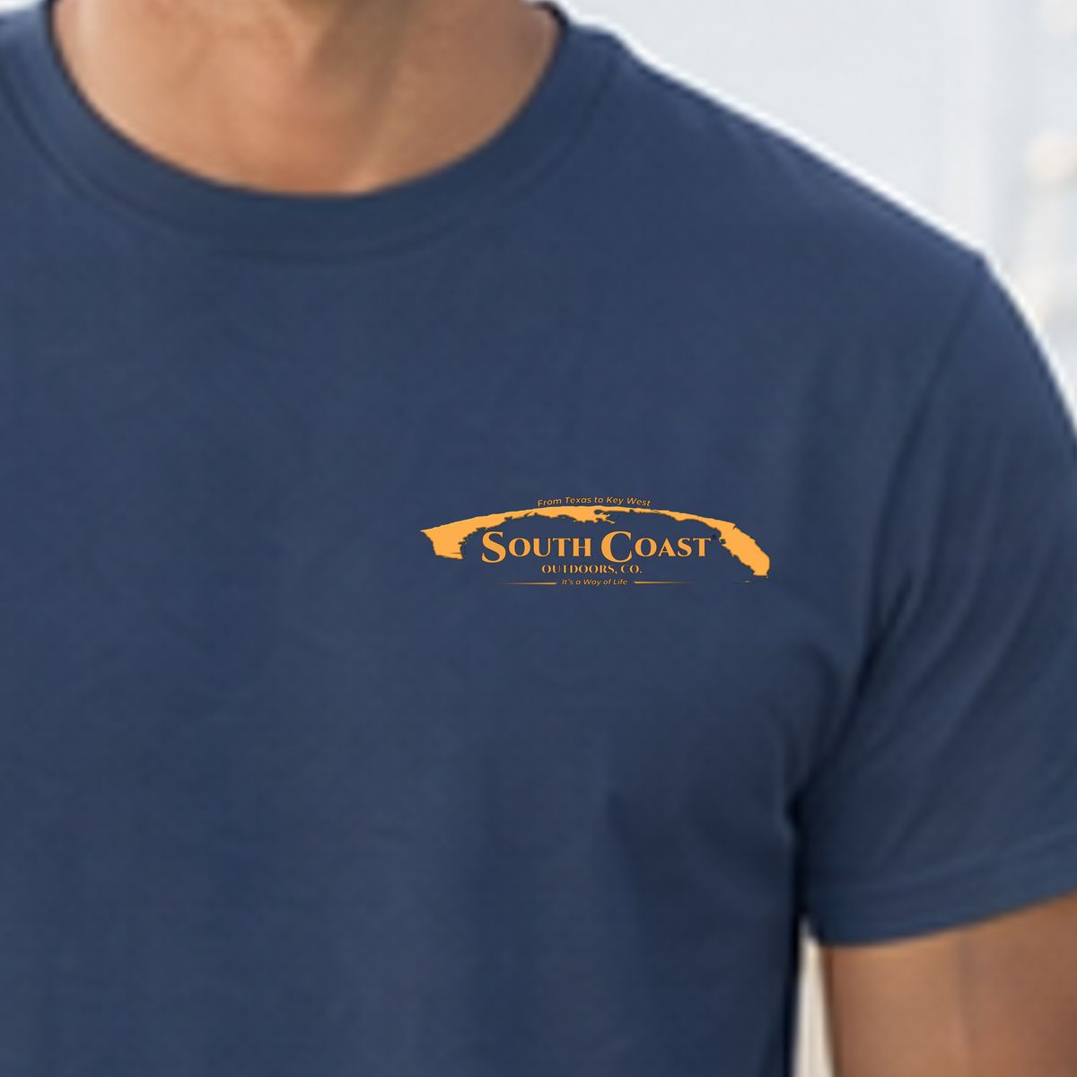Navy blue T-shirt with small two-dog logo graphic on chest