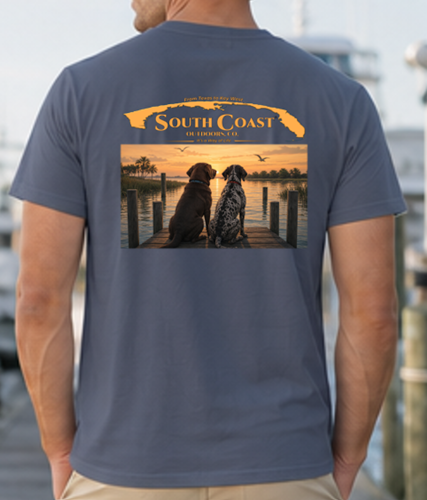 Navy T-shirt with back graphic of two dogs on dock at sunset.
